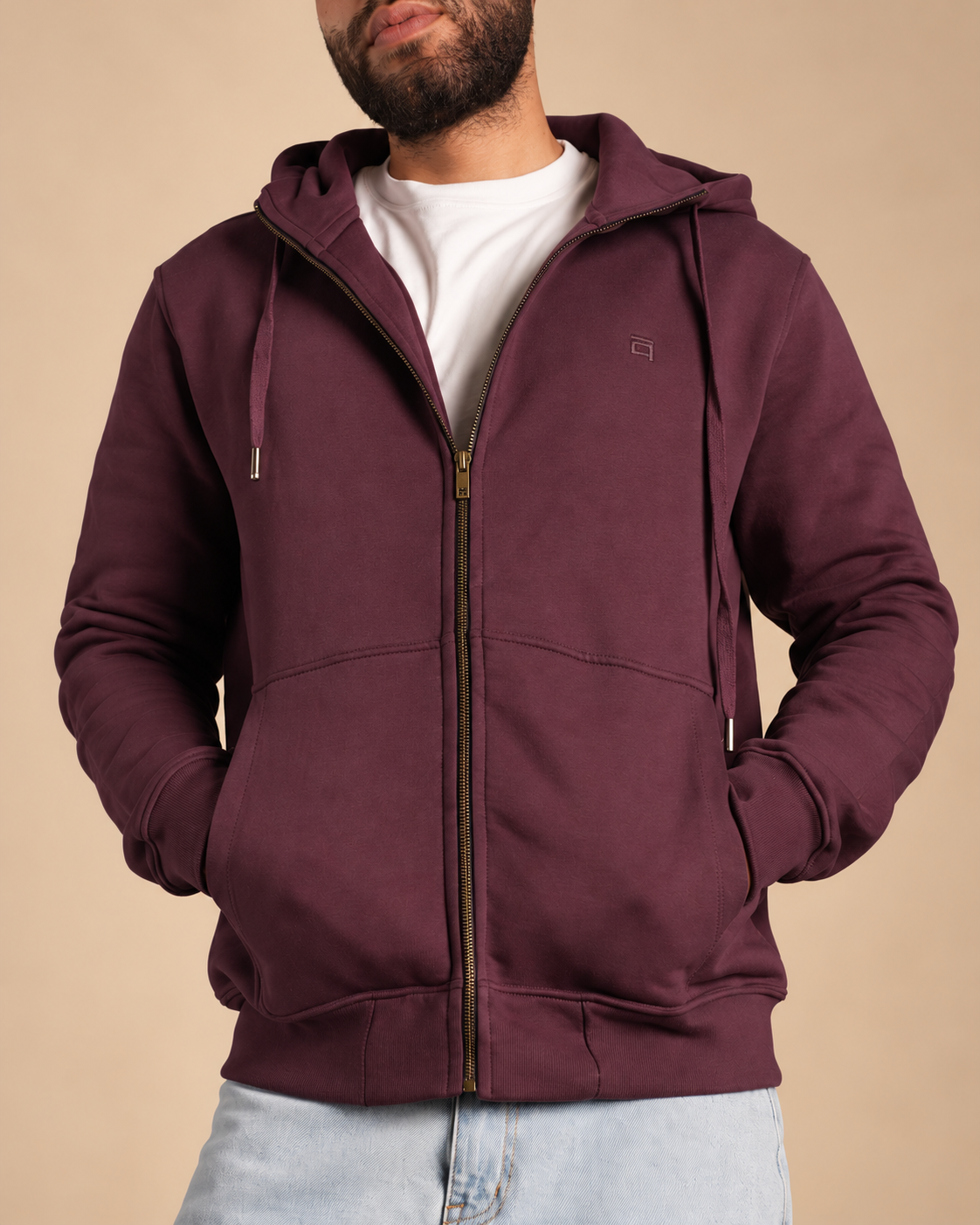 Stabraq High Neck Melton Zipper in burgundy, half-face upper-body front view with hands in pockets on a beige studio background
