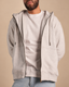Stabraq High Neck Melton Zipper in heather gray, half-face upper-body front view with zipper open on a beige studio background