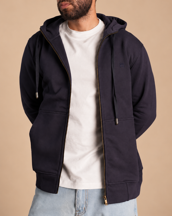 Stabraq High Neck Melton Zipper in navy blue, half-face upper-body view looking to the side on a beige studio background