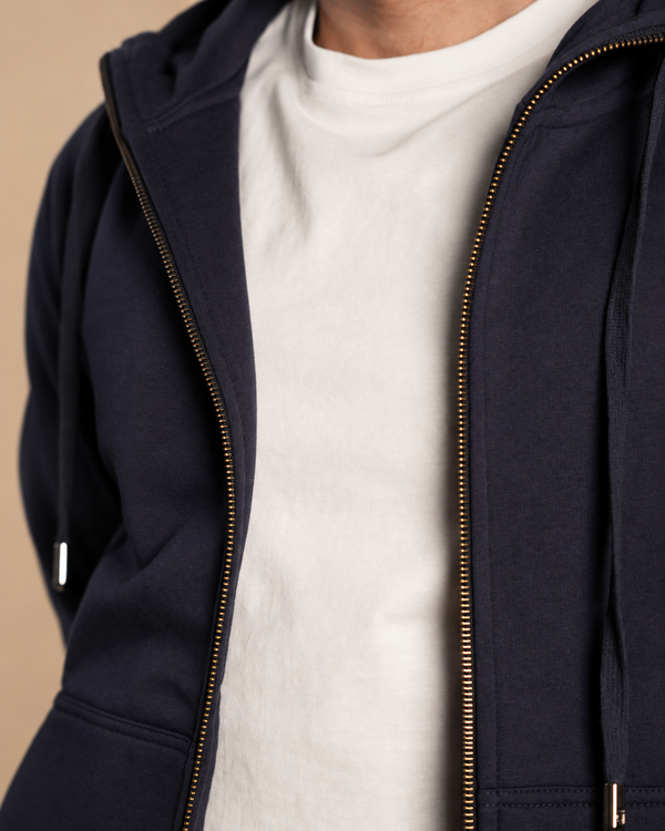 Stabraq High Neck Melton Zipper in navy blue, close-up of the neckline and open zipper on a beige studio background