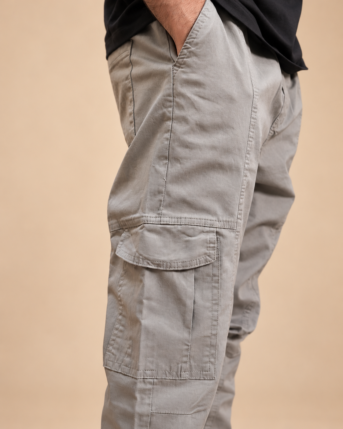 Iconic Cargo - close-up cargo pocket and stitching detail in beige studio