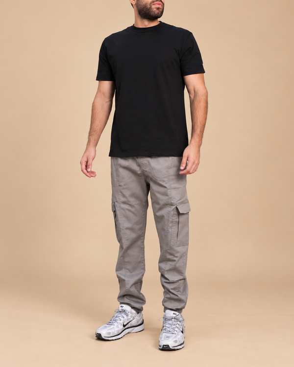 Iconic Cargo - full outfit with lower-face crop in beige studio