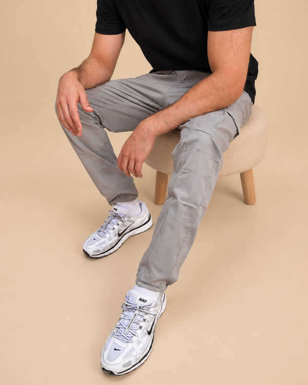 Iconic Cargo - seated lower-body view in beige studio
