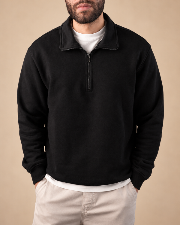 Stabraq Black Quarter Zipper, upper-body view cropped to the lower face on a beige studio background