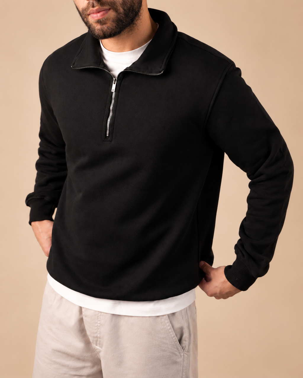 Stabraq Black Quarter Zipper, upper-body view cropped to the lower face on a beige studio background