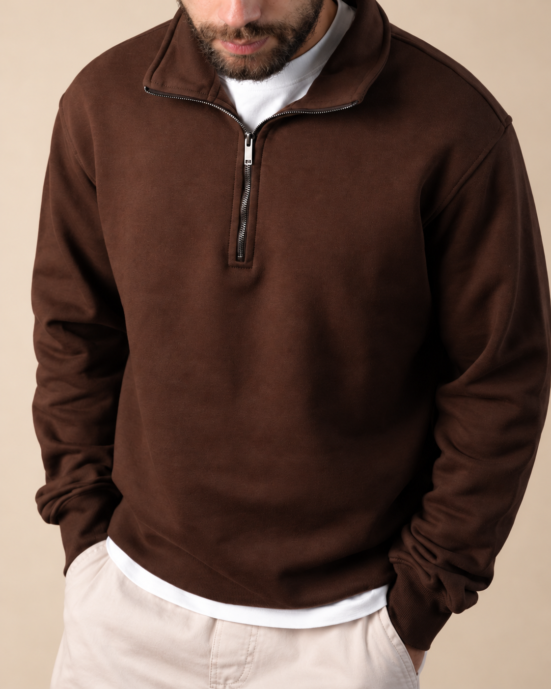 Stabraq Brown Quarter Zipper, upper-body view cropped to the lower face on a beige studio background