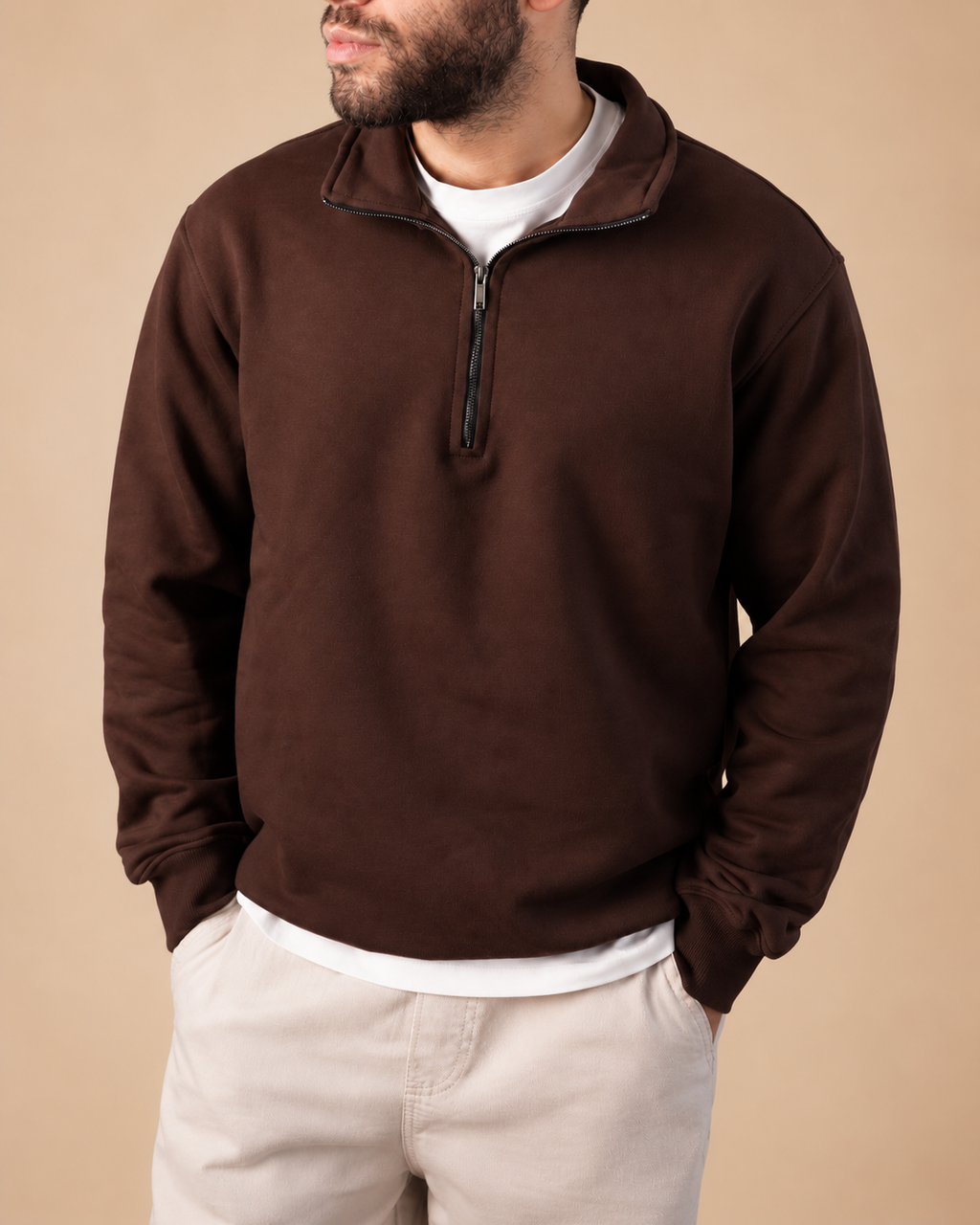Stabraq Brown Quarter Zipper, upper-body view cropped to the lower face on a beige studio background