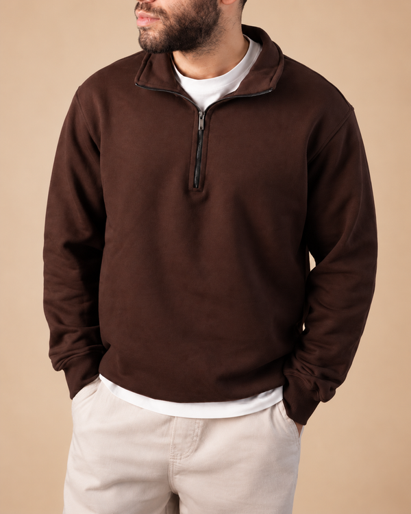 Stabraq Brown Quarter Zipper, upper-body view cropped to the lower face on a beige studio background