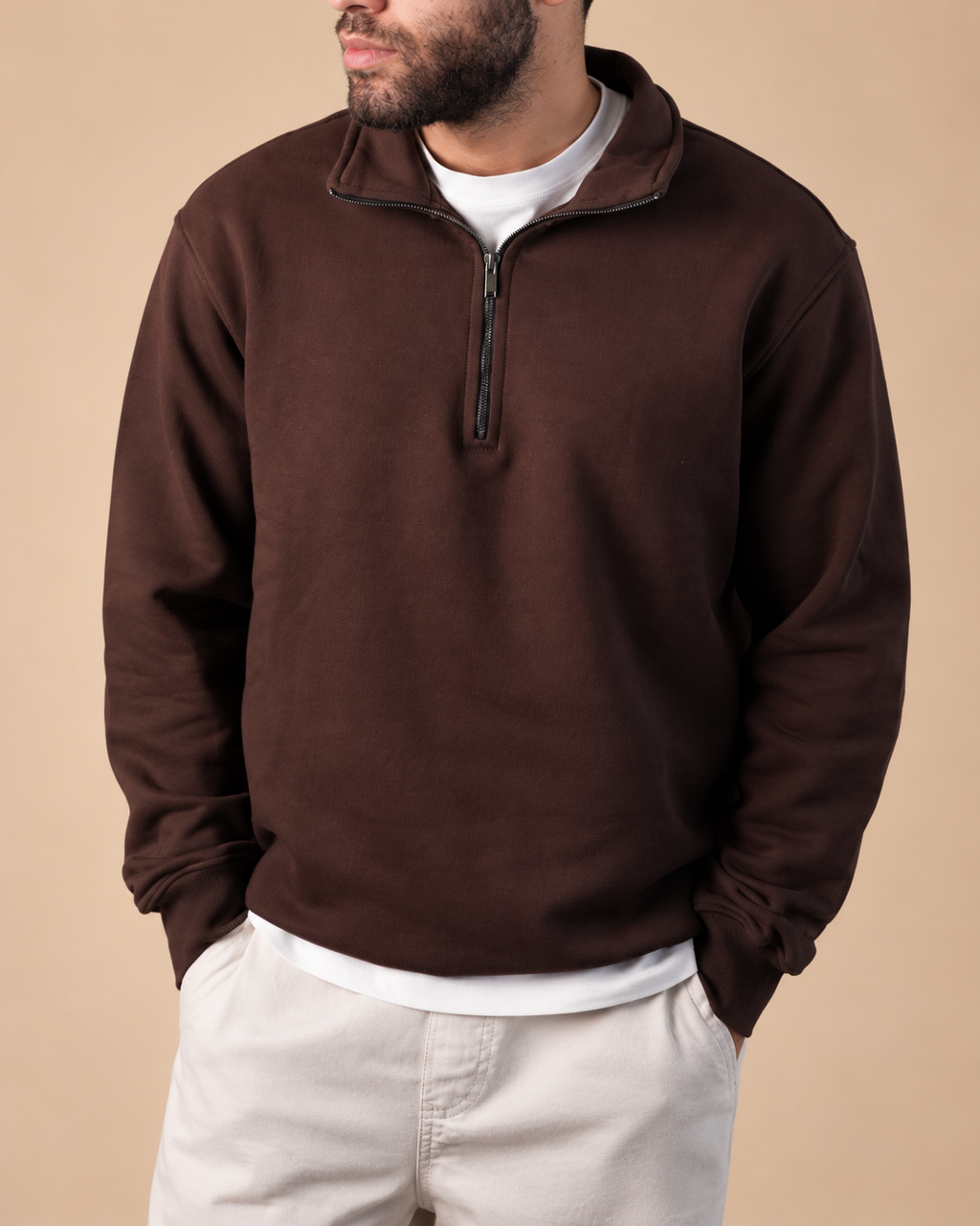 Stabraq Brown Quarter Zipper, upper-body view cropped to the lower face on a beige studio background