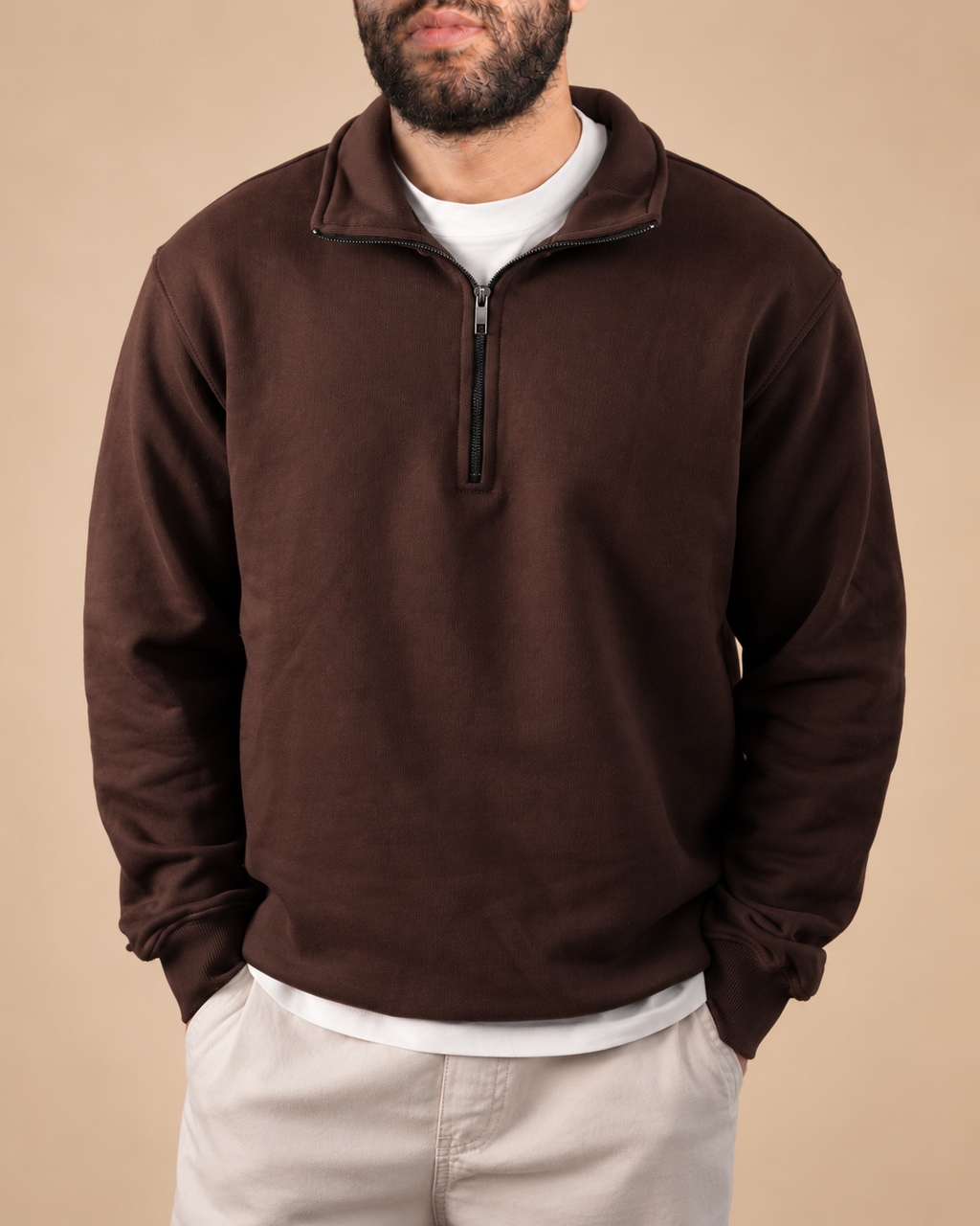 Stabraq Brown Quarter Zipper, upper-body view cropped to the lower face on a beige studio background