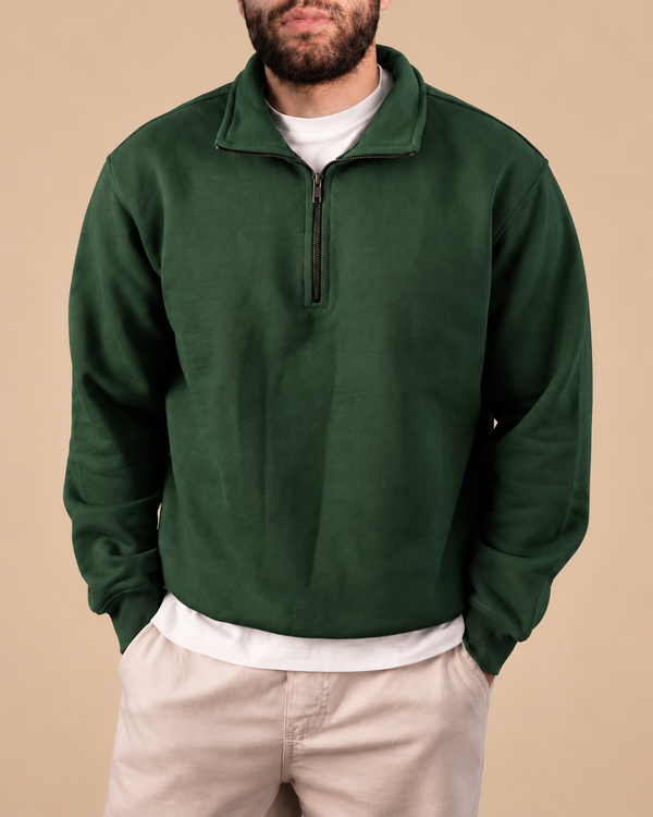 Stabraq Green Quarter Zipper, upper-body view cropped to the lower face on a beige studio background