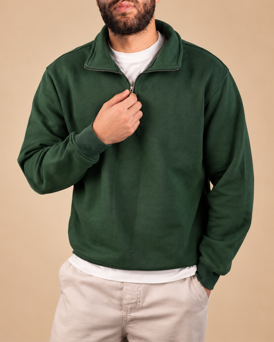 Stabraq Green Quarter Zipper, upper-body view cropped to the lower face on a beige studio background