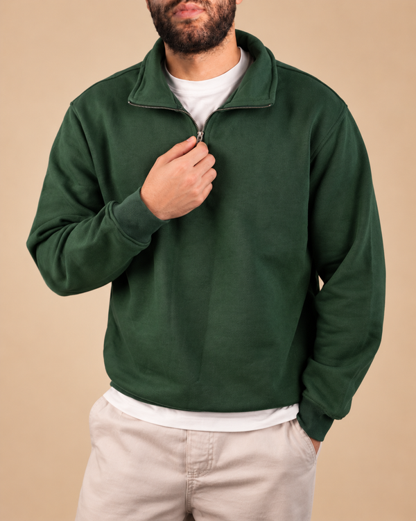 Stabraq Green Quarter Zipper, upper-body view cropped to the lower face on a beige studio background