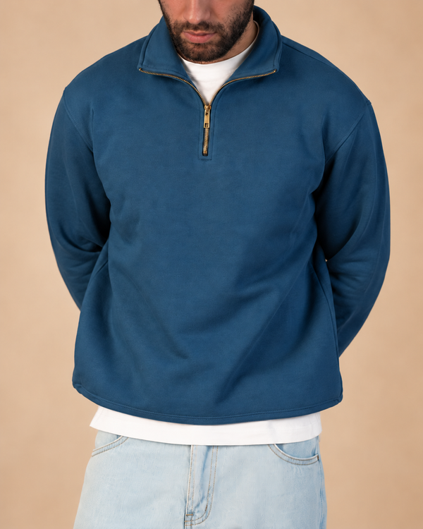 Stabraq Indigo Quarter Zipper, upper-body view cropped to the lower face on a beige studio background