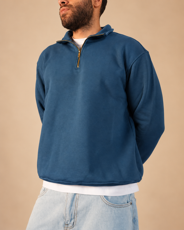 Stabraq Indigo Quarter Zipper, upper-body view cropped to the lower face on a beige studio background