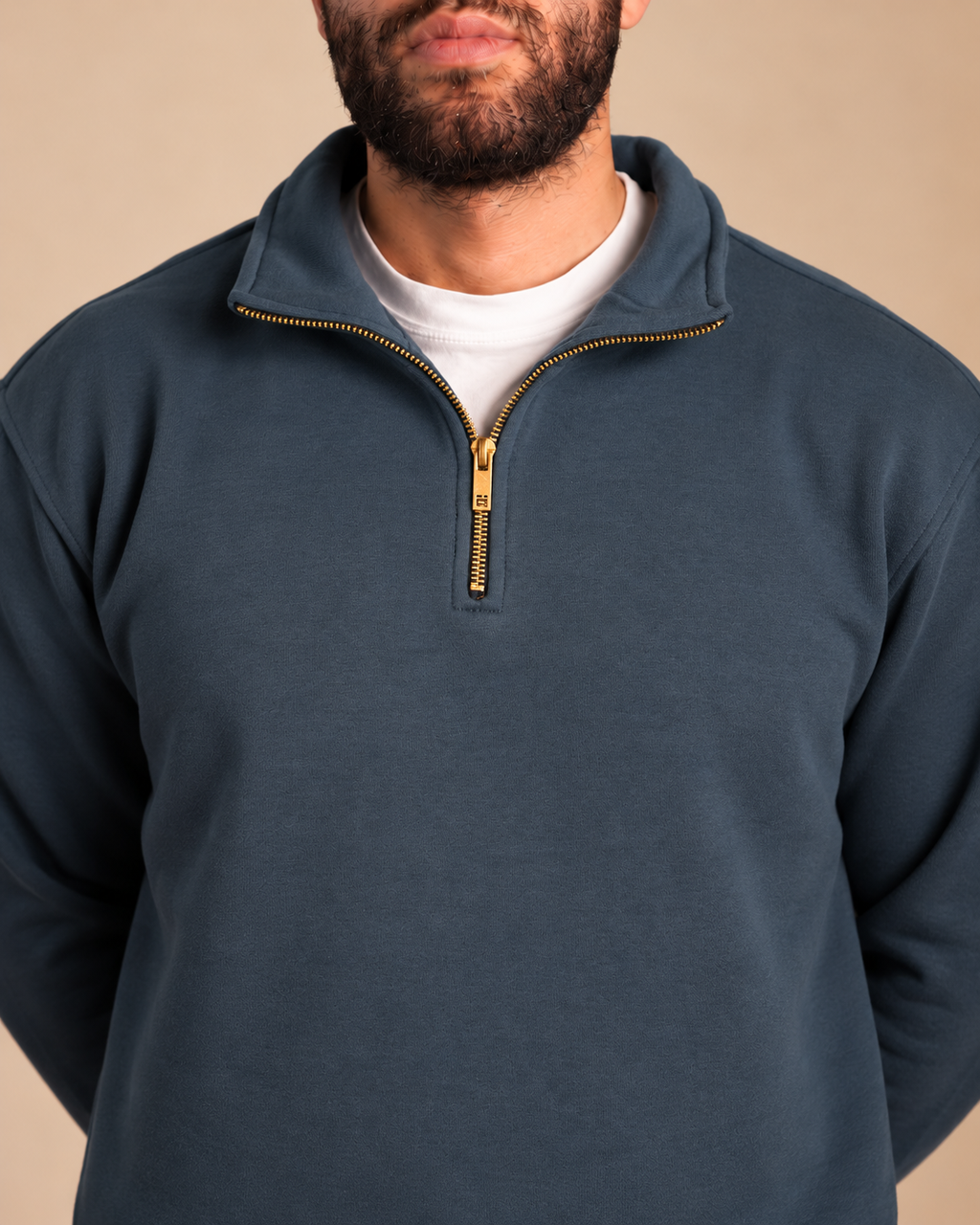 Stabraq Indigo Quarter Zipper, close-up of the collar and zipper on a beige studio background