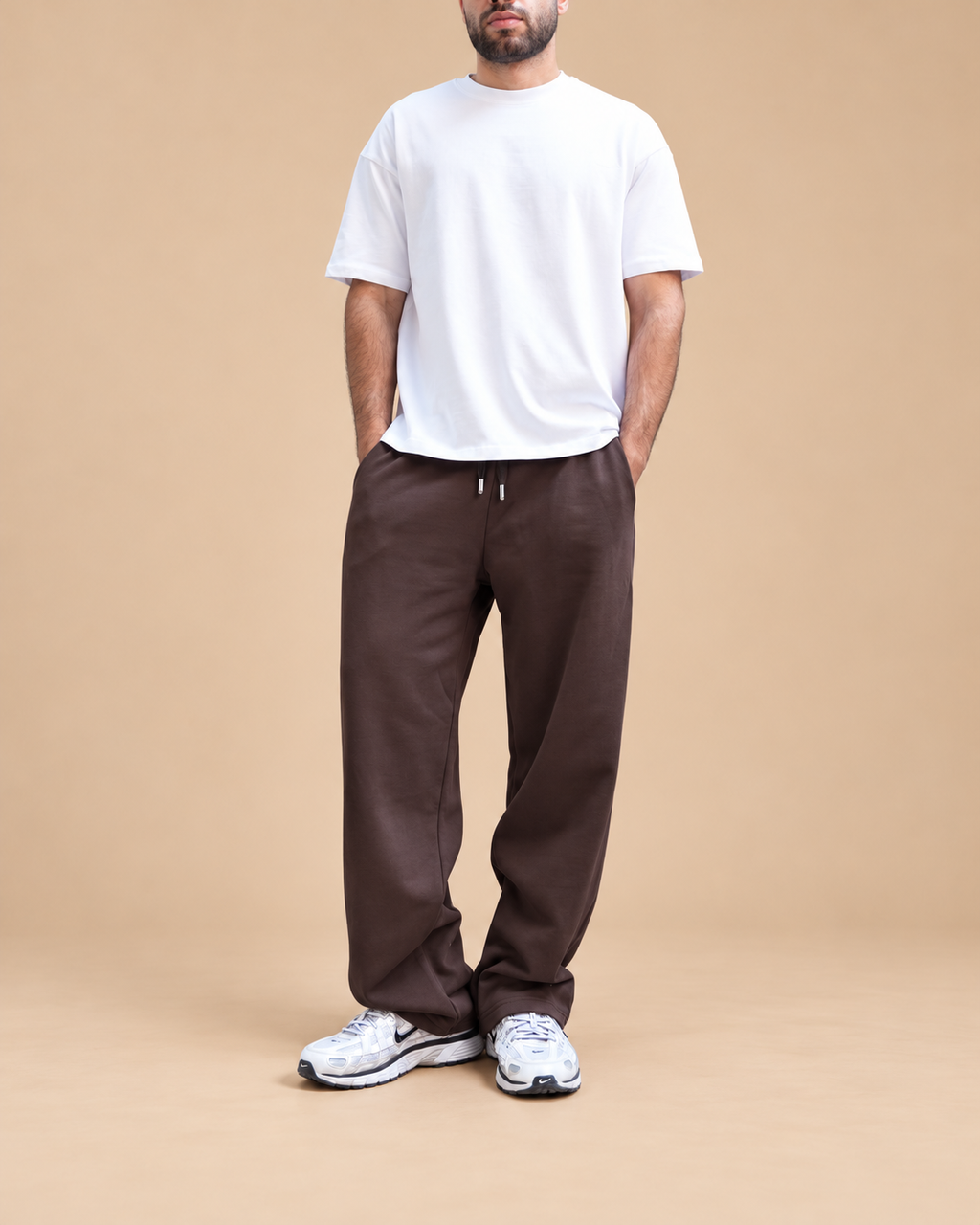 Wide-Leg Sweatpants Brown - full outfit with lower-face crop in beige studio